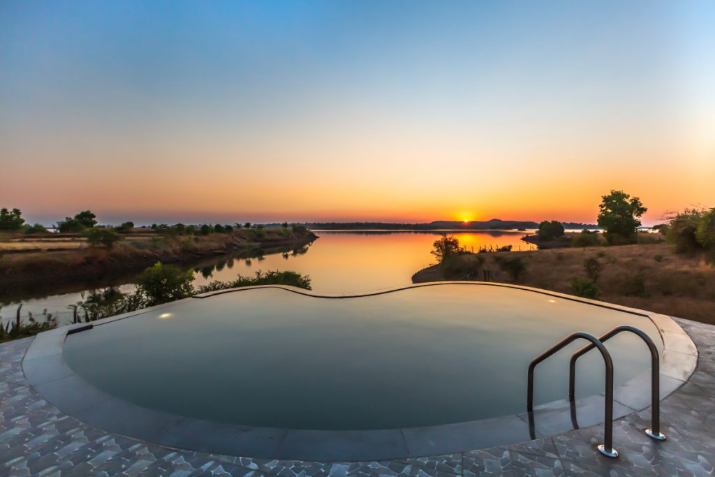 Infinity pool, sunrise, lake