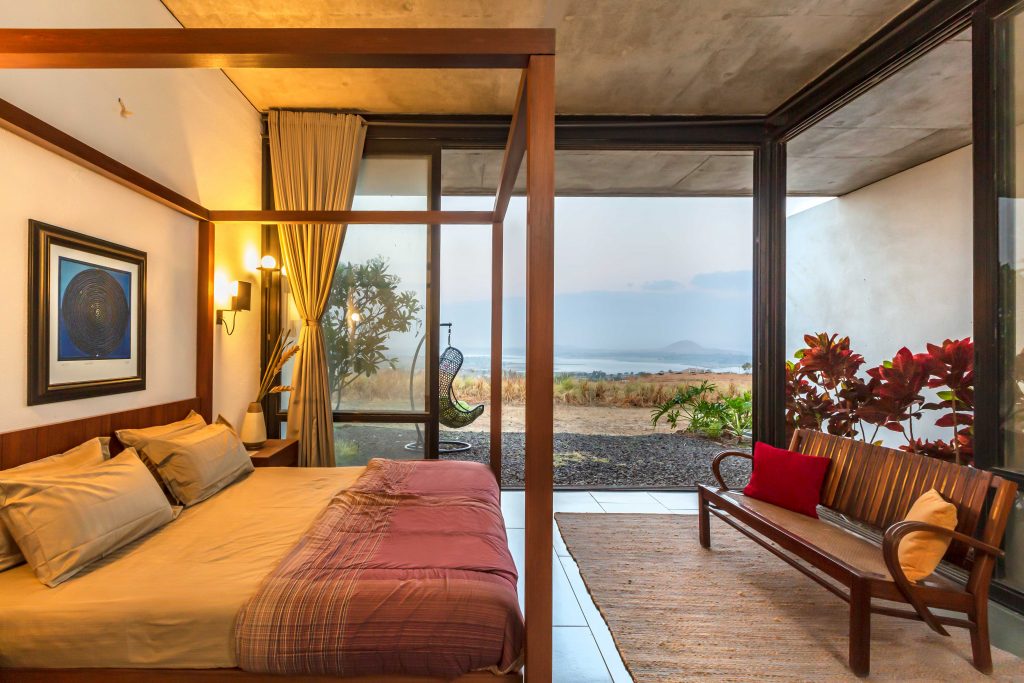 bedroom with lakeview near mumbai