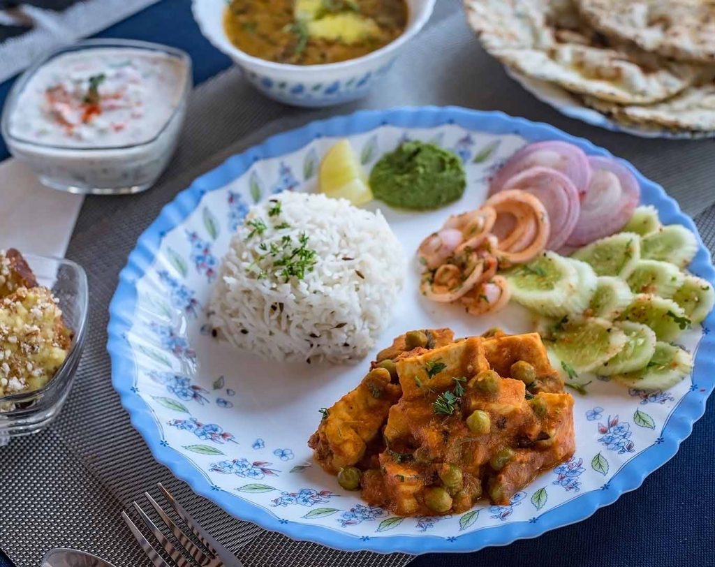 Experience local authentic meals prepared by the in-house chef at SaffronStays Nashik Villa