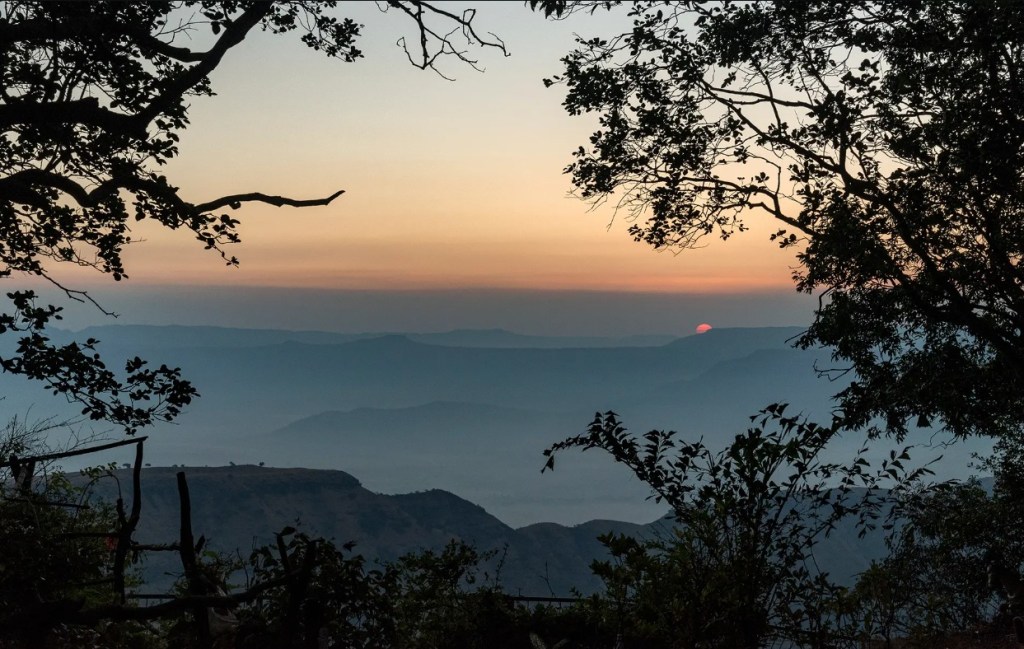 Heritage villa verandah in Matheran overlooking the monsoon forest, Raigad hill station