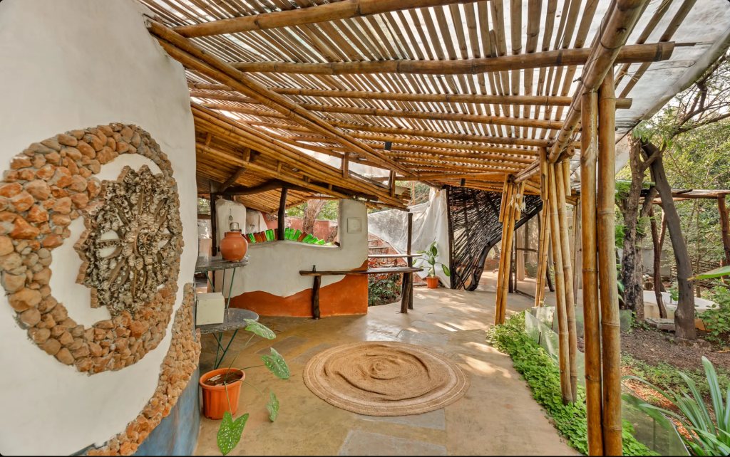 Mud, stone and bamboo exterior of SaffronStays Maativan villa in Wada, Maharashtra, surrounded by reserved forest