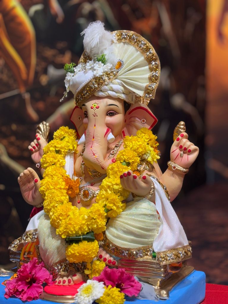 Ganpati idol welcomed into a traditional home in Sindhudurg during Ganeshotsav